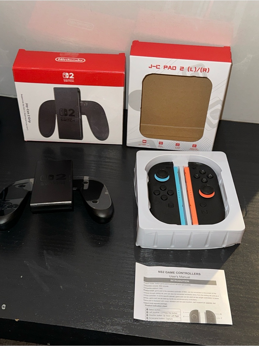 Nintendo Wireless Joy-Con Blue and Orange Accents with Nintendo game grip